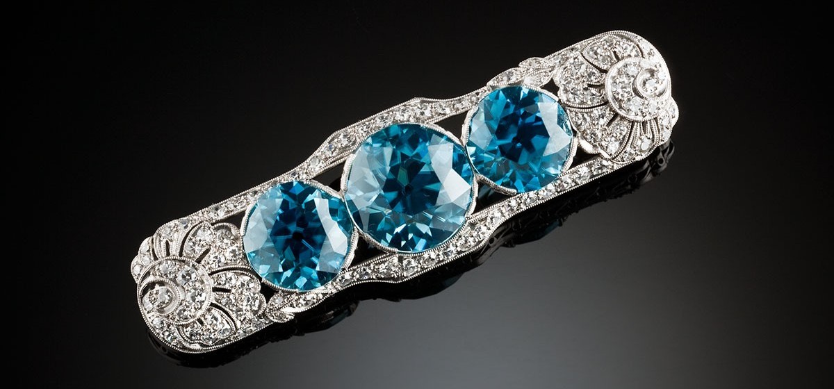 Art Deco blue zircon and diamond platinum brooch. Walton & Co