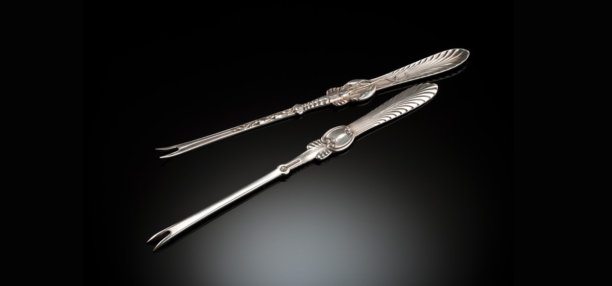 An Antique cased American sterling silver lobster fork set by Frank w. Smith Silver & Co