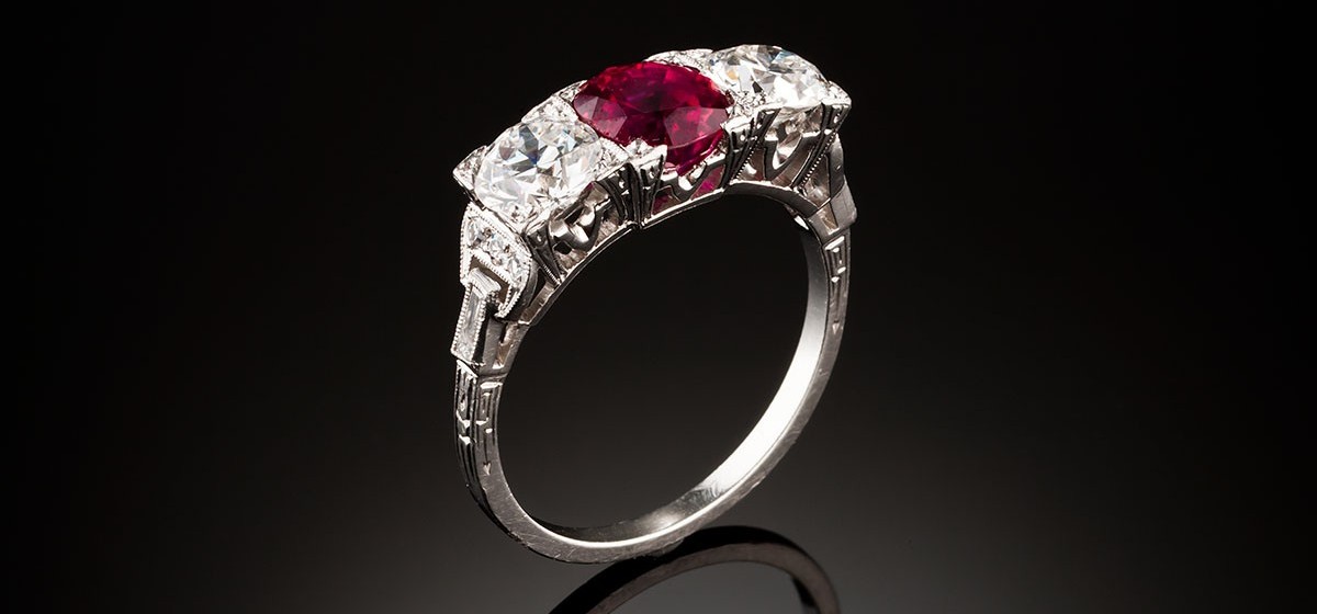 An Art Deco ruby and diamond three stone ring