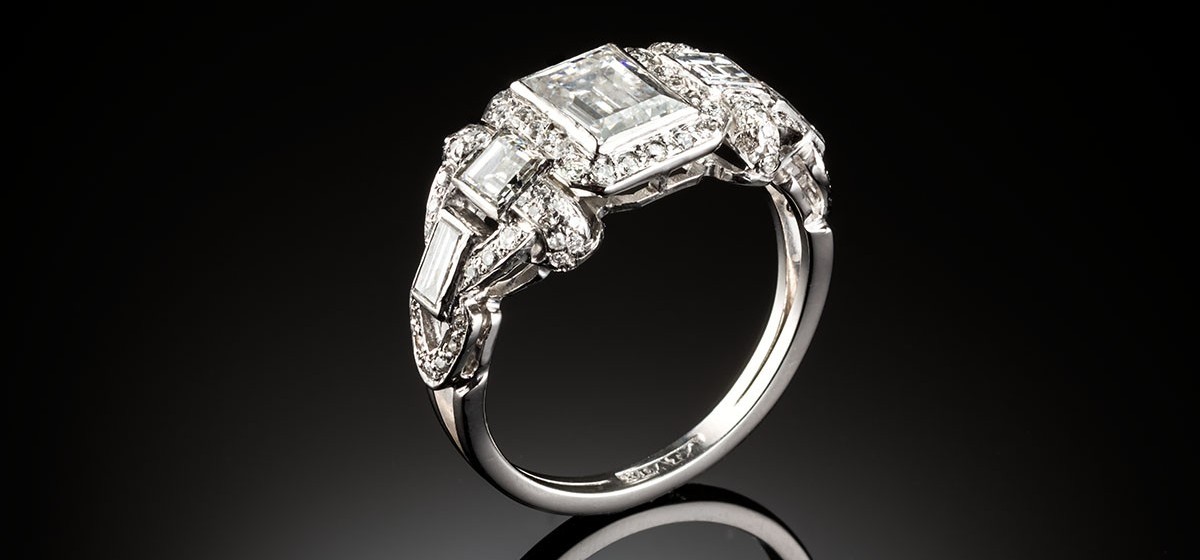 A late Art Deco platinum and rectangular cut diamond ring, circa 1938