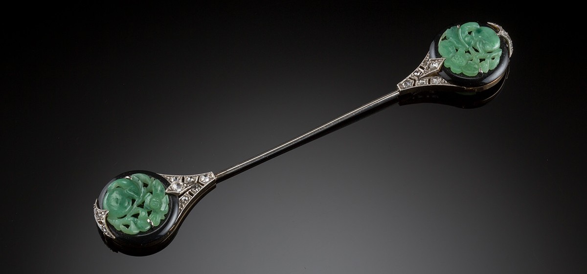 An Art Deco jade, diamond and onyx jabot pin