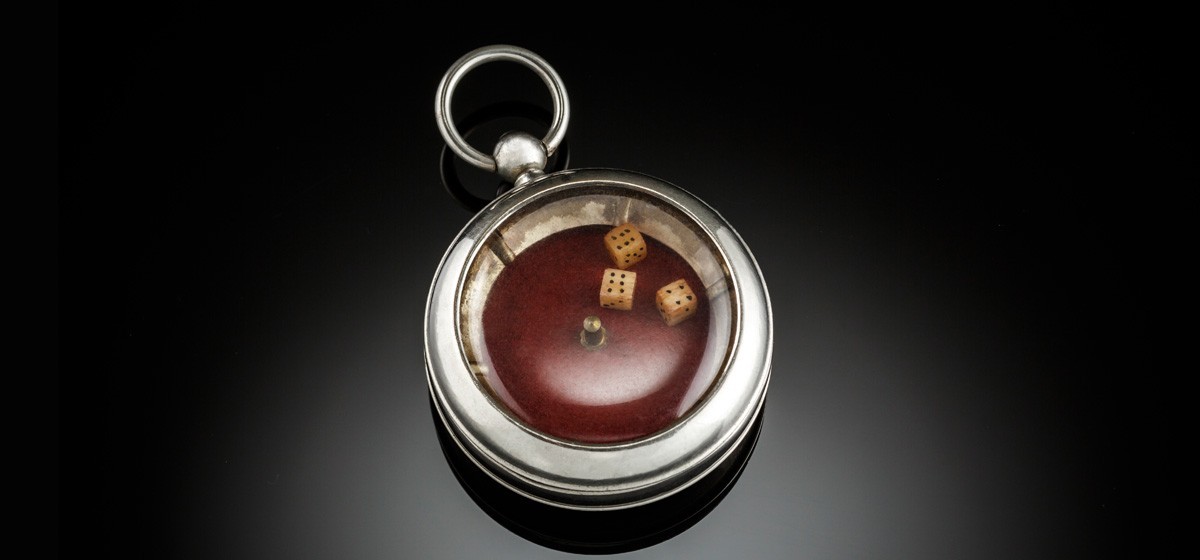 A Vintage pocket dice gambling device in pocket watch design