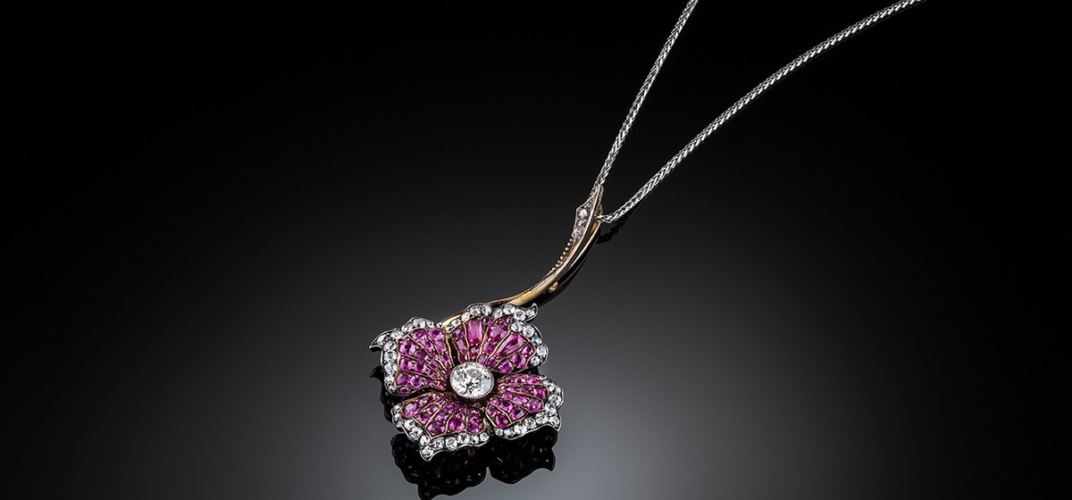 An Early Twentieth Century ruby and diamond flower pendant/brooch