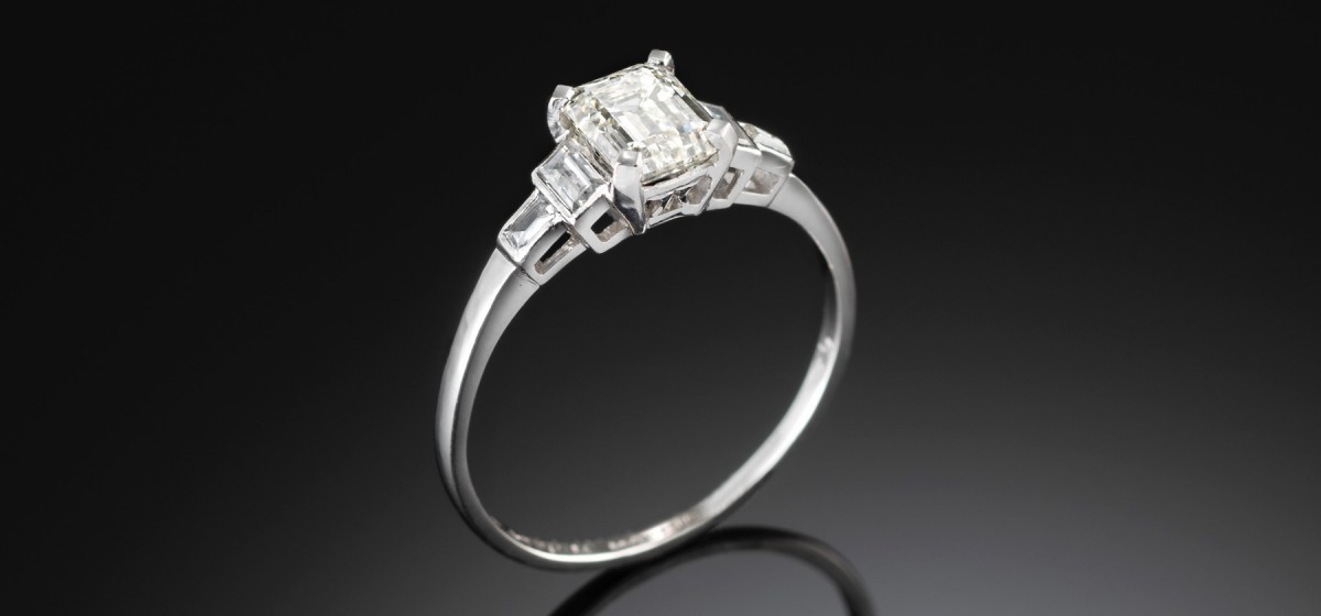 Art deco platinum and emerald cut diamond ring by historic mappin and webb