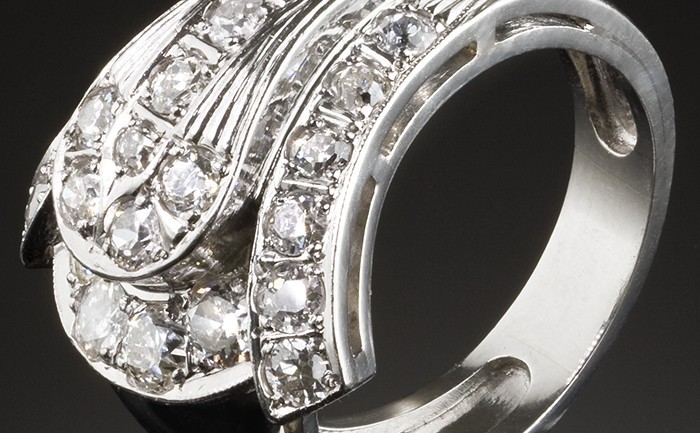 A late Art Deco diamond buckle ring