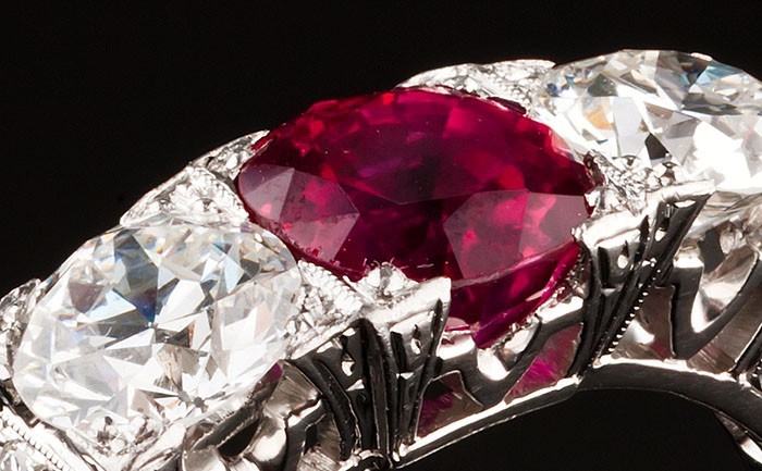 An Art Deco ruby and diamond three stone ring