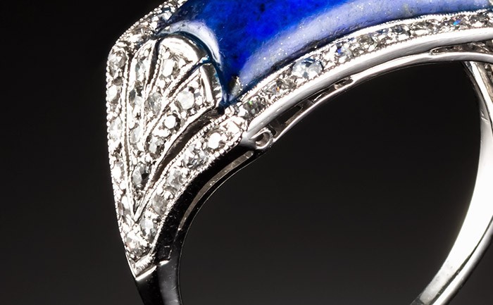 A French Art Deco lapis lazuli and diamond saddle style ring