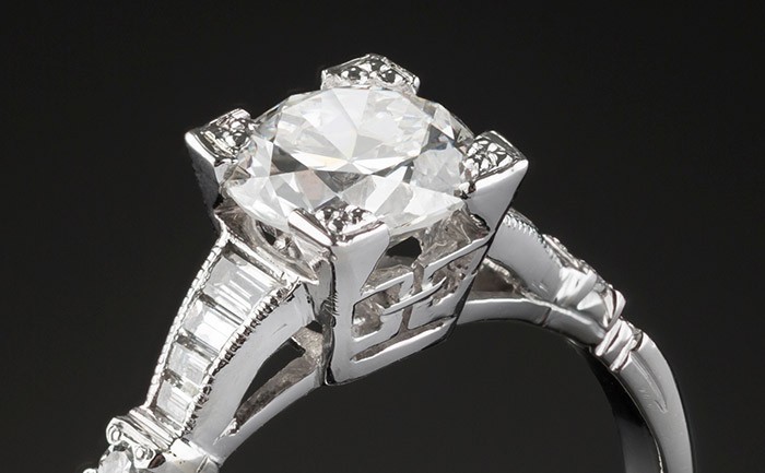 An art deco solitaire transition cut and graduated baguette cut diamond ring