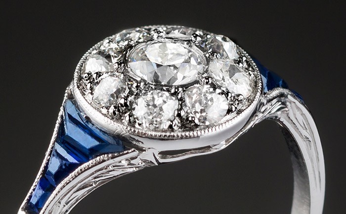 A classic art deco diamond sapphire and platinum round cluster ring 
