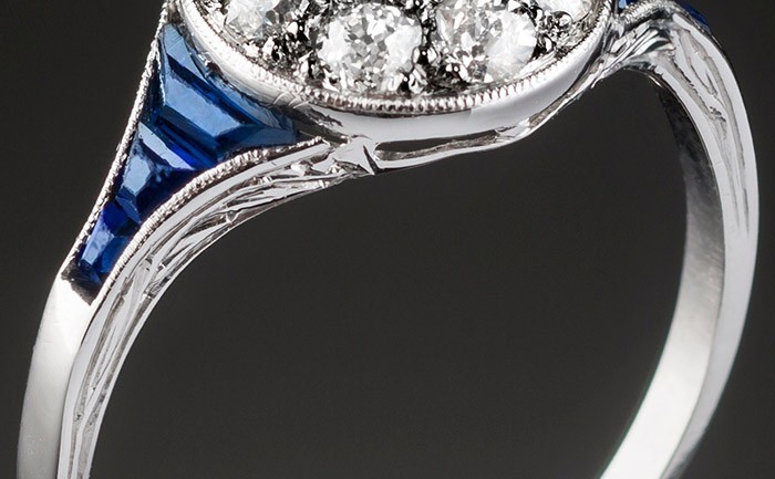 A classic art deco diamond sapphire and platinum round cluster ring 