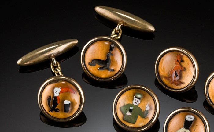 Detail of a 1920s set of reverse intaglio Essex crystal style Guinness cuff links and buttons / studs  depicting the zoo keeper and his animals