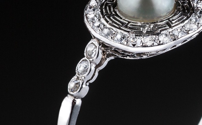 Detail of a Belle Epoque pearl and old cut diamond platinum set fine ring