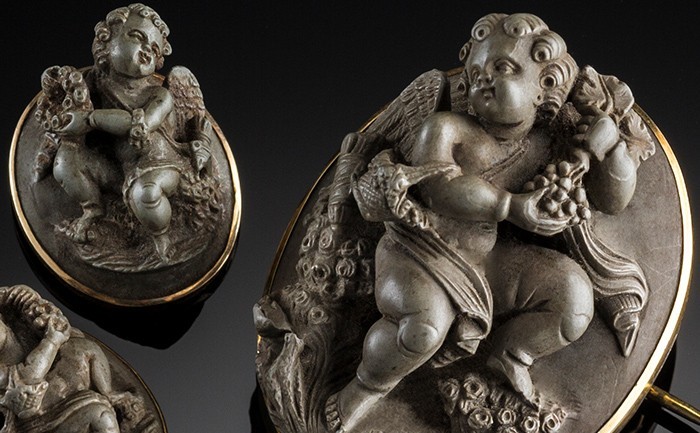 Detail of an Antique gold set lava cameo brooch from a demi parure with earrings