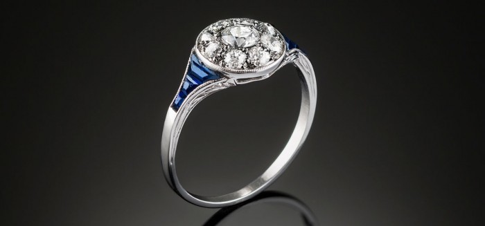 A classic art deco diamond sapphire and platinum round cluster ring