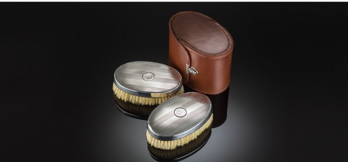 Pair of Art Deco sterling silver clothes brushes in a custom made leather case