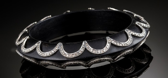 An Art Deco ebony and diamond set bangle