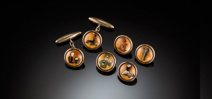 A 1920s set of reverse intaglio crystal Guinness cuff links and buttons / studs