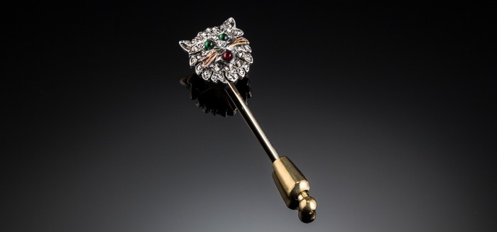 An Antique diamond cat’s head stick pin set in silver topped gold