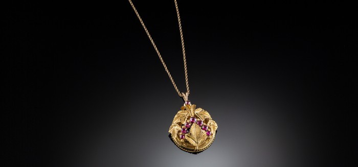 An antique bloomed gold and rhodolite garnet pendant