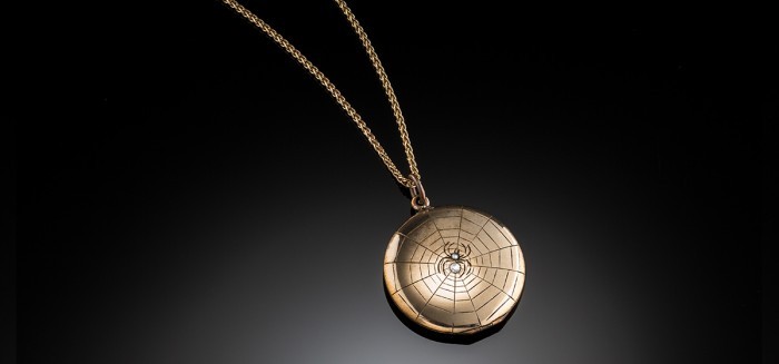 An Antique gilt and paste locket pendant