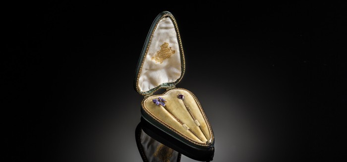 A pair of love token enamelled stick pins by Child & Child in the original heart shaped box