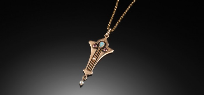 ART NOUVEAU PENDANT OF SILVER GILT RUBIES OPAL AND NATURAL SEED PEARL